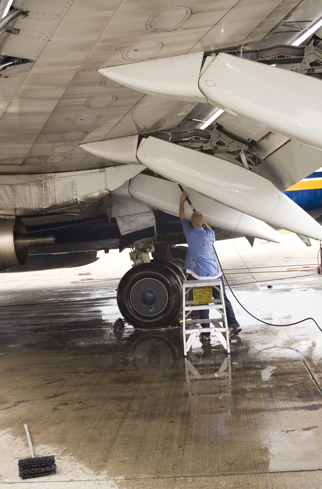 Washing the wings of an aircraft.