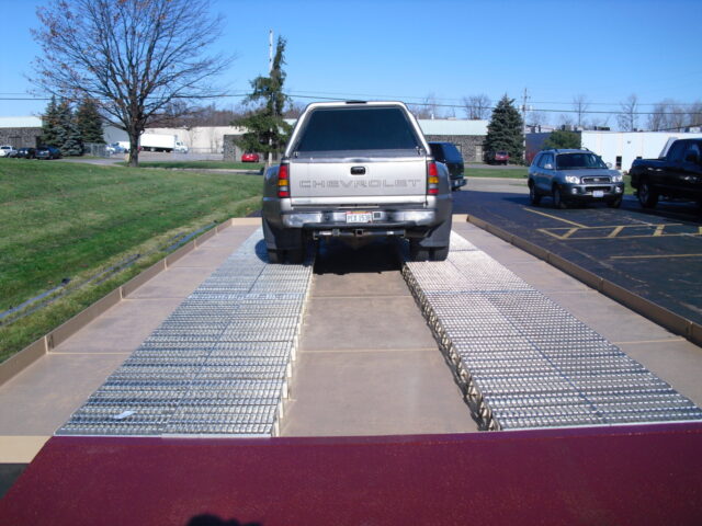 Wash pad with drive over grating installed